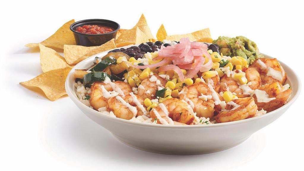 Garlic Shrimp Bowl · Sauteed shrimp, cilantro lime rice, black beans, poblano peppers and onions, corn salsa, garlic lime sauce, guac, queso fresco, cilantro cabbage and pickled red onions. Served with chips and salsa.