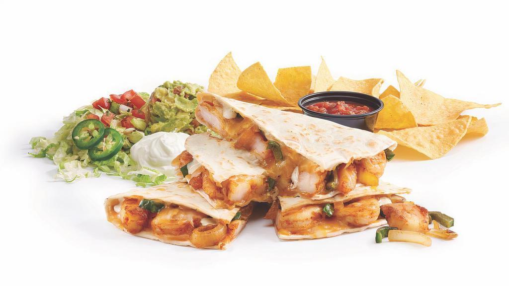 Fajita Shrimp Quesadilla · Sauteed shrimp, poblano peppers and onions, cheddar jack cheese, and garlic lime sauce, with guac and sour cream. Served with chips and salsa