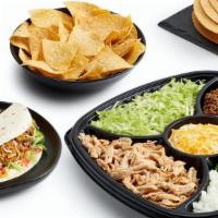 Taco Take-Home Meal Kit · Includes choice of hard corn, soft flour or wheat tortillas, chicken, beef, toppings, tortil...