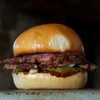 Beef Brisket · – fire and smoke, enjoy the show–bbq sauce, pickles, and onions