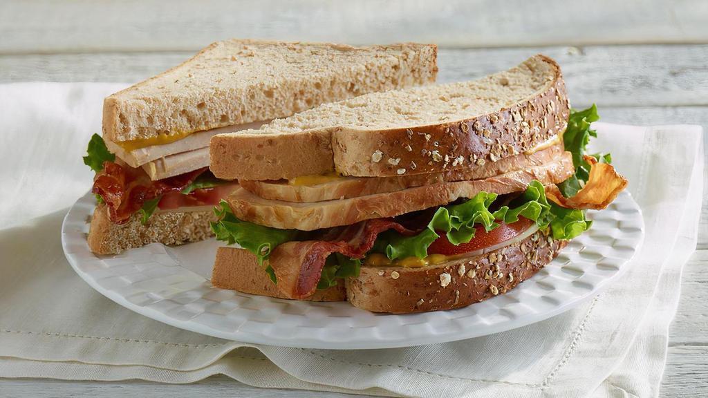 Turkey Club · Oven roasted turkey breast, provolone, crispy bacon, honey mustard, lettuce & tomato. Includes your choice of any Fresh Side, Scoop, or Cup of Soup. Served on your choice of flaky croissant, traditional white or wheatberry bread.