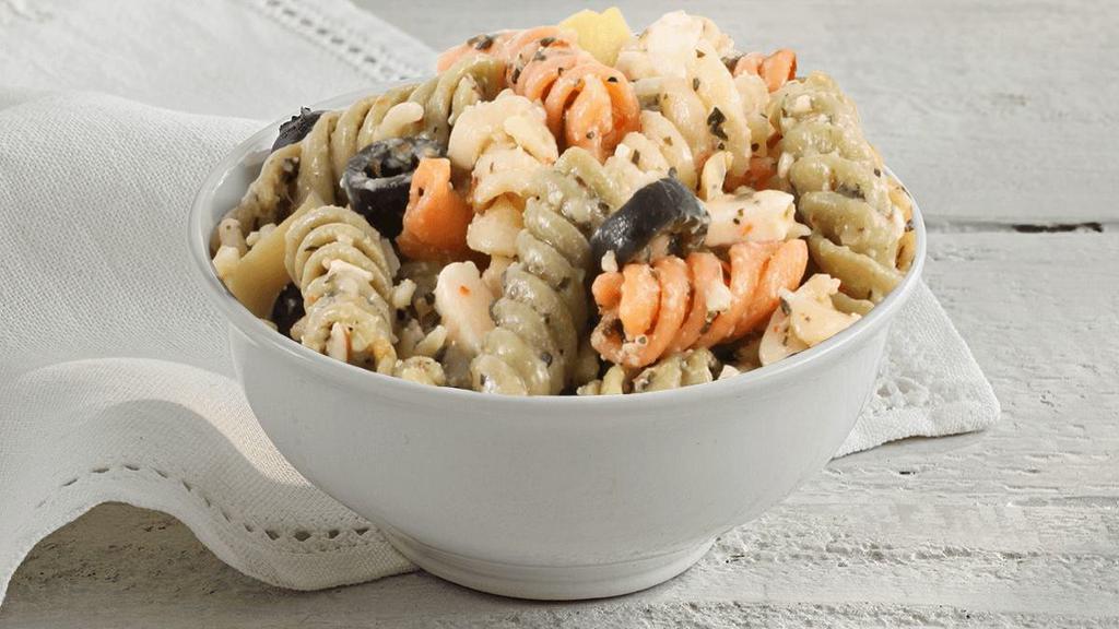 Pasta Salad · Tri-color rotini pasta in an Italian based dressing with feta & parmesan cheeses, black olives & artichoke hearts.