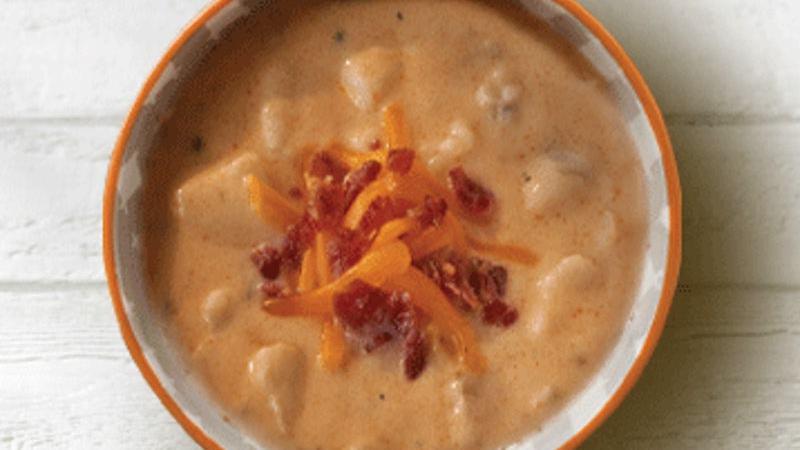 Loaded Potato Soup · Potatoes blended with cream, bacon, chives and a touch of spice create this thick and hearty soup.