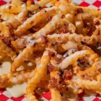 Ultimate Fries · Seasoned crinkle-cut fries topped with cheese dip and crumbled bacon.