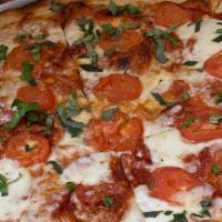 Margherita Pizza · Hand-stretched dough with fresh mozzarella cheese, tomatoes, fresh basil, garlic and balsami...