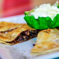 Fajita Quesadillas · We improved on the traditional quesadilla by and adding deliciously seasoned sautéed onions,...