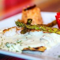 El Bandido Pollo · Chicken breast cooked with bacon and white cream sauce with a large shrimps on top. Served w...