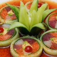 Naruto Cucumber · Salmon, tuna, yellowtail, avocado, shredded carrots, cucumber wrap & spicy ponzu sauce