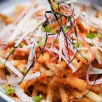 Volcano Fries · Seasoned fries with msc kanikama salad, spicy mayo, eel sauce