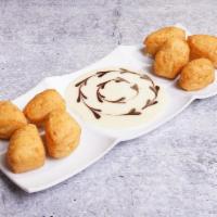 Thai Donuts · Served with sweet condensed milk dipping sauce