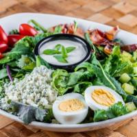 Cobb Salad · Fresh greens, grape tomato, cucumber, hardboiled egg, bacon, crumbled gorgonzola, green onion.