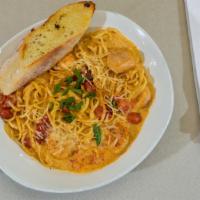 Blackened Shrimp & Scallop Pasta · Blackened shrimp and scallops, creamy lobster sauce, green onions, house-roasted tomatoes, l...