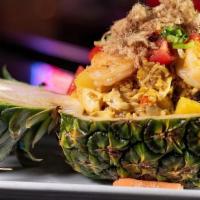 Pineapple Fried Rice · Shrimp, chicken, carrot, green pea, egg, chunks of pineapple top with cashew nut, and dry po...
