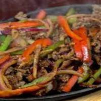 Steak / Carne Fajitas · Served with salad, tortillas, rice beans.