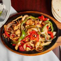 Fajitas Chicken · chicken, bell pepper, onion, tomatoes, served with rice, beans, salad, and tortillas Flour.