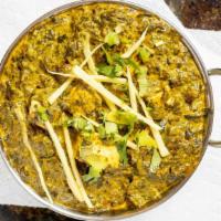 Palak Paneer · Home-made cubes of cheese cooked with spinach in a creamy sauce with green bell pepper. Serv...