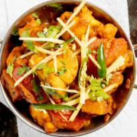 Aloo Gobi Masala · Cauliflower and potatoes cooked with mildly spice garlic and ginger.