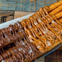 Twistmania · Irresistible combination of freshly made churros glazed with the most delicious topping of y...