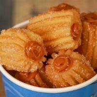 Churrobites Filled · Delicious churro bites covered in sugar and filled with your favorite topping