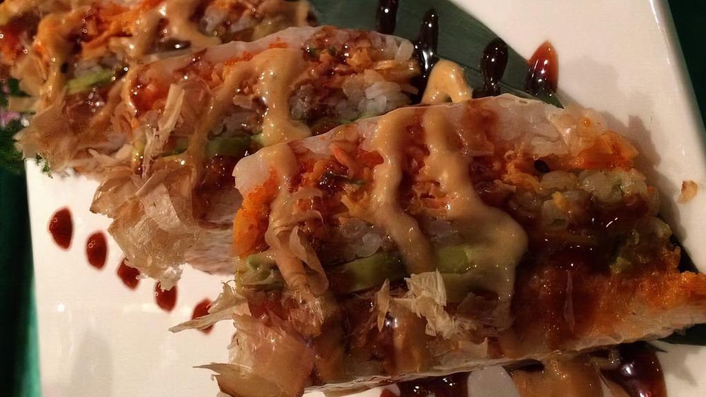 Big Mac Roll · Spicy tuna, tobiko, avocado, snow crab inside, topped with soy bean wrap bonito flake, tobiko outside with eel sauce, spicy mayo.