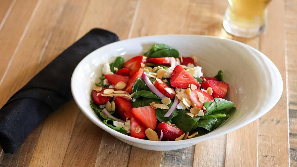 Strawberry & Goat Cheese Salad · baby spinach, red onion, toasted almonds, poppy. seed vinaigrette