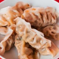 8 Pack Dumplings · Steamed with your choice of Green Vegetable or Ginger Chicken.