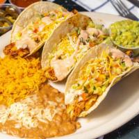 Fish Tacos · “Corn tortillas, grilled Mahi Mahi, Chipotle Cream, lettuce, Pico de gallo, cheese and guaca...