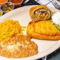Chimichanga · Large fried burrito, filled with rice, pico de gallo, cheese, and cream sauce. Your choice o...