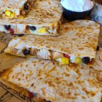 Baja Quesadilla · Marinated and Grilled chicken breast combined with our Freshly shredded Monterrey  jack chee...