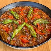 Fam Steak Paella · Valencia style rice, bistro steak, piquillo confit, pimientos de padron, asparagus, red sofr...