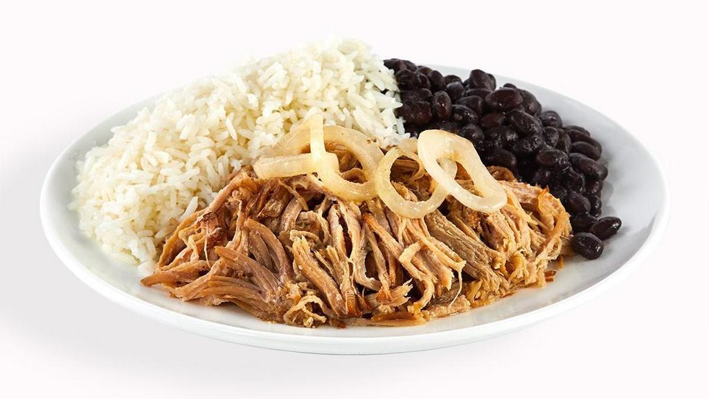 Mojo Roast Pork - With Rice & Beans · Slow roasted in a mojo juice blend, our pork is a moist and tender marvel crowned with sautéed onions.