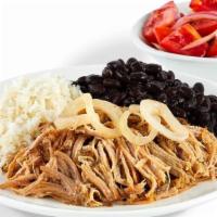 Mojo Roast Pork - With Rice And Beans And 1 Additional Side · Slow roasted in a mojo juice blend, our pork is a moist and tender marvel crowned with sauté...