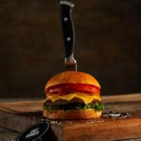 Portobello Burger · Crispy portobello on a brioche bun topped with cheese, lettuce, tomatoes, pickles, mayonnais...