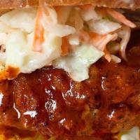 The Dirty Bird · Crispy Fried Chicken smothered in a Georgia Peach laced Spicy Nashville Sauce with Pickles a...