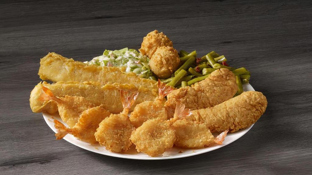 Supreme Sampler · Two pieces of our famous batter dipped fish, two chicken tenders, and six butterfly shrimp. Served with your choice of two sides and hush puppies.