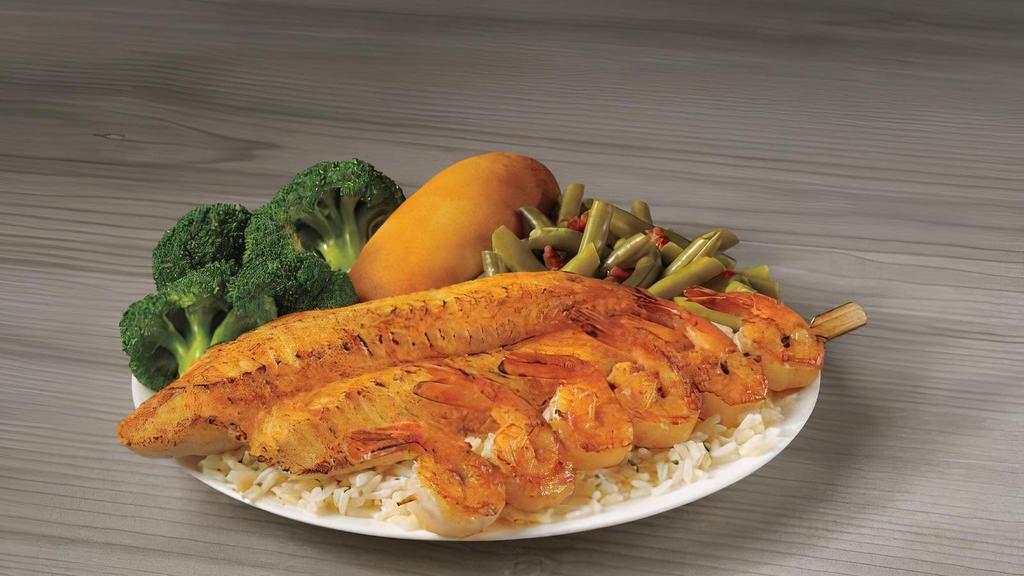 Grilled White Fish & Shrimp Skewer Meal · A fillet of our delicious grilled white fish served alongside a skewer of succulent grilled shrimp. Served on a bed of rice with your choice of two sides and breadstick.