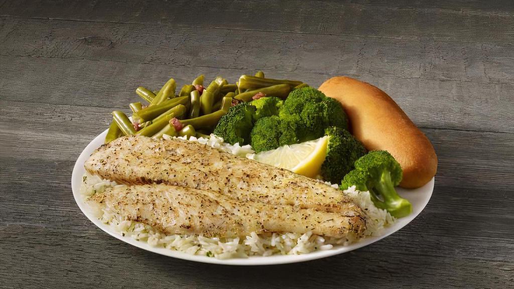 Lemon Pepper White Fish Meal · A fillet of our tender and flaky white fish, seasoned with pepper and tangy lemon. Served on a bed of rice with your choice of two sides and breadstick.