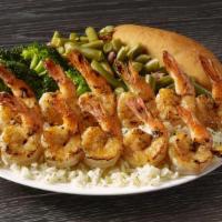 Shrimp Skewers Meal · Plump seasoned shrimp that are seared to perfection and served on a bed of rice with your ch...
