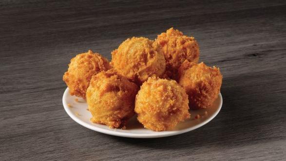6 Hush Puppies · Our famous golden brown hush puppies are made from a batter that’s freshly prepared and hand scooped with care. They are perfectly paired with our seafood meals.