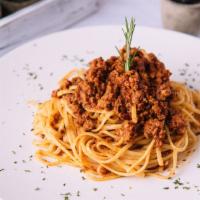 Spaghetti Bolognese · Ground beef with tomato sauce and parmesan cheese.