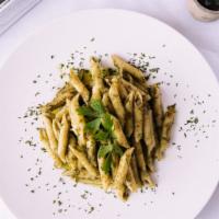 Penne Rigate Pesto · Traditional genovese sauce (basil, garlic, peanuts, olive oil and parmesan grated)