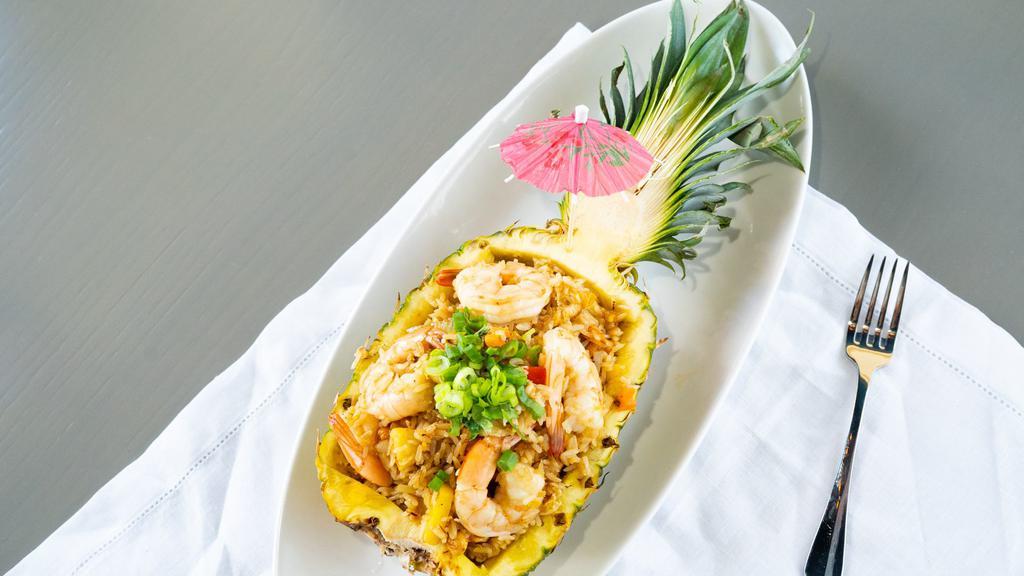 Shrimp Pineapple Fried Rice · Famous fried rice with egg, onions, chopped bell peppers, carrots, scallions, and cashew nuts.