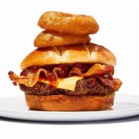 Western Bbq Burger · One 1/4lb burger, BBQ sauce, melted Cheddar, bacon and onion rings all wrangled into a toast...