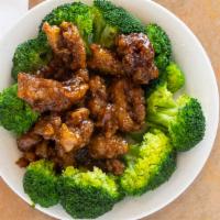 General Tso Chicken · Chucks of crispy chicken in spicy sauce with broccoli.