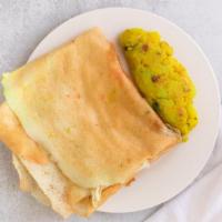 Masala Dosa · Thin crepe made of rice & lentils and stuffed with potatoes and onions.
