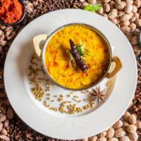 Dal Tadka · Yellow Lentils sautéed with Onions Tomato Spices.