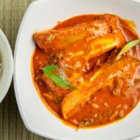 Andhra Fish Curry · Fish cooked in traditional Indian spices and curry.