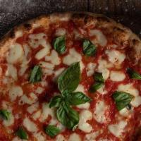 Margherita Vegana Pizza · Vegan. Hand crush tomato, vegan mozzarella, fresh basil, and Evoo.