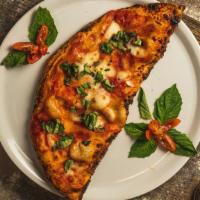 Calzone · Hand crushed tomato, mozzarella, ricotta, ham, fresh basil, and Evoo.