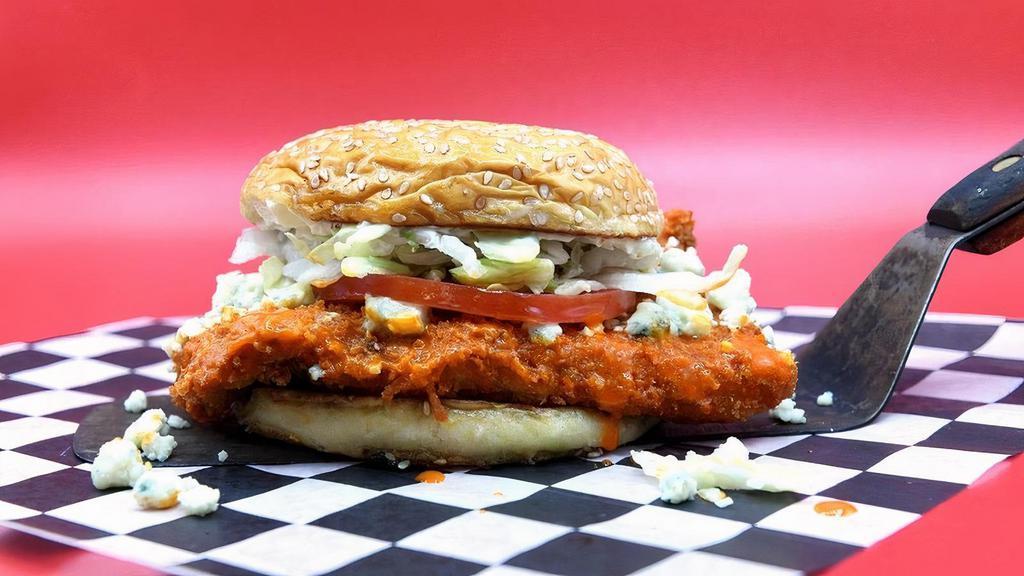 Buffalo Soldier · Panko-crusted chicken breast, Cluck’s original buffalo-style sauce, blue cheese crumbles, lettuce, tomato, and mayo